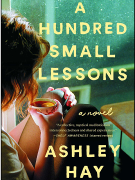 A green book with a woman holding a cup of tea - A Hundred Small Lessons