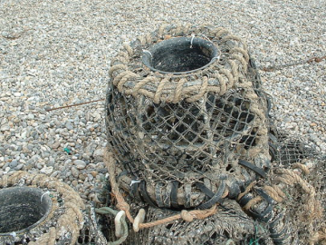 A photo of lobster pots stacked on top of each other.