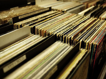 A photograph of stacked vinyl records.